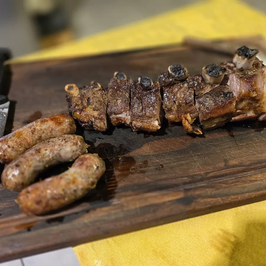 Grilled ribs and chorizo on a board